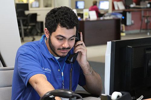 MediaTech staff member on phone